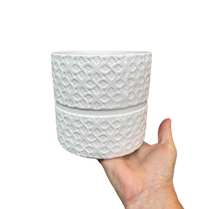 white laced plant cover pot